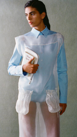 Del Core dress, model holding Silent Spring book