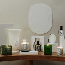 Diptyque candles on a table.