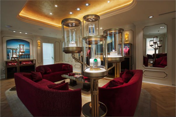 red velvet couch with jewelry display