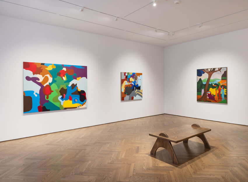 Interior of the Gray Gallery showing three abstract and colorful paintings on the wall.
