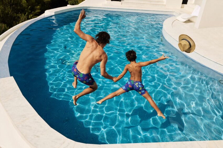 People jumping into pool wearing Vilebrequin swimwear.