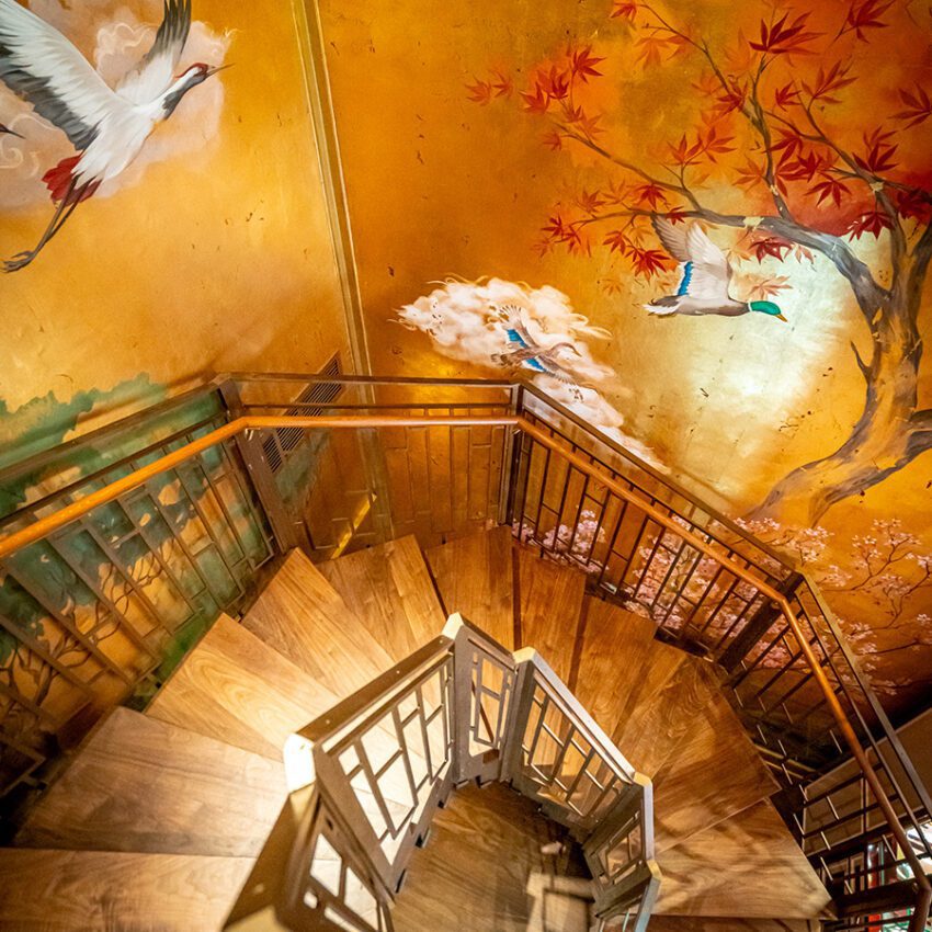 Birley Bakery spiral staircase, gold wallpaper with cranes