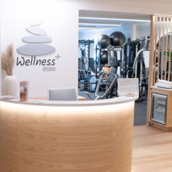 Wellness studio reception with fitness equipment.