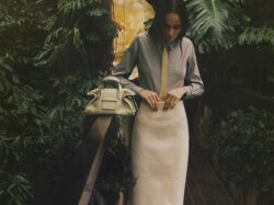 model holding Jimmy Choo handbag