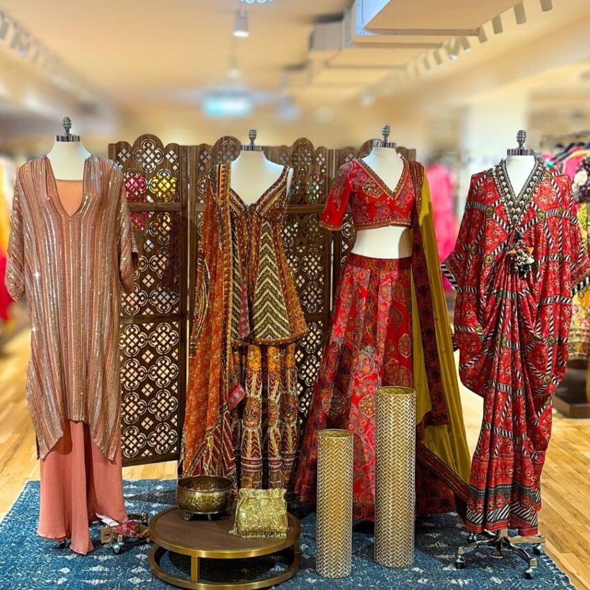 4 mannequins dressed in Pernia's Popup festive garments