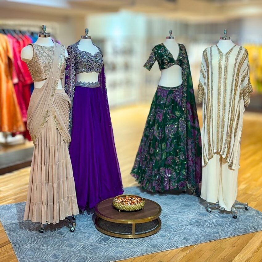 4 mannequins dressed in Pernia's Popup festive garments