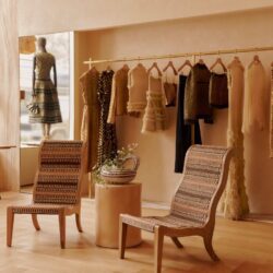 Ulla Johnson madison ave boutique interior two chairs. clothes dispayed