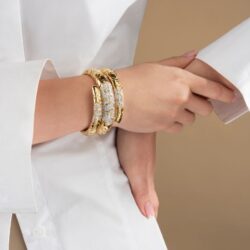 model wearing Marina B gold & diamond bracelet
