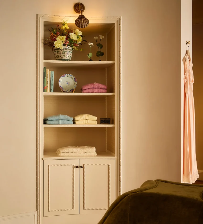 wall cabinet with sweaters, dress hanging