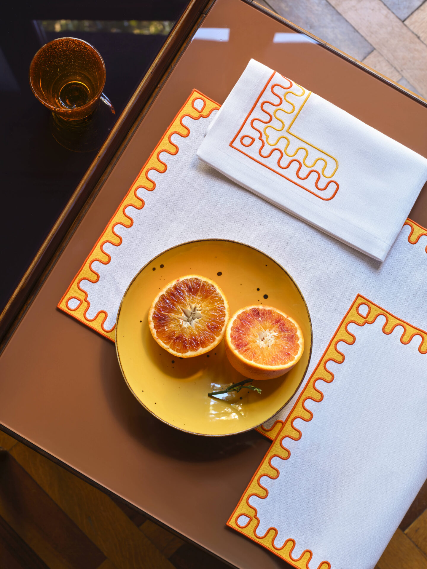 white and orange Frette table linens