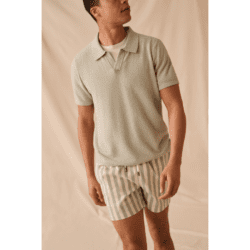 Male model wearing Onia green polo and shorts