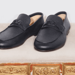 men's Valentino loafer shoes on a chair