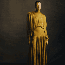 Model wearing yellow gold Altuzzura dress