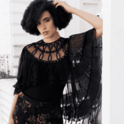 Model wearing black Anne Fontaine sweater and pants.
