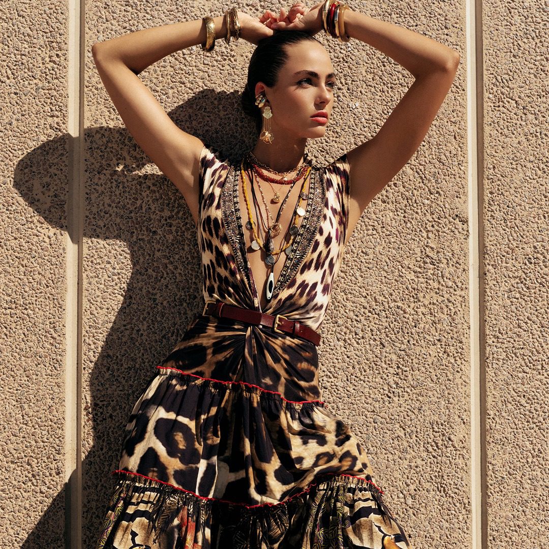 Model wearing leopard print dress