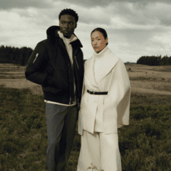 male and female model wearing Mackage coats in the country side