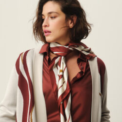 model Marina Rinaldi wearing silk shirt, sweater and scarf.
