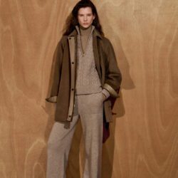 Model wearing Max Mara taupe knit pant set and brown coat