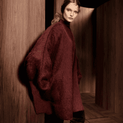 Model wearing Max Mara burgundy coat