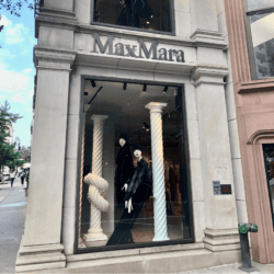 Max Mara madison avenue window with mannequin wearing black coat