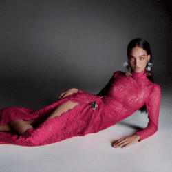 Model wearing red lace Monique L'Huillier dress