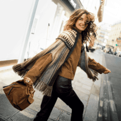 model wearing ba&sh suede jacket, poncho,jeans and bag