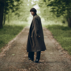 Alfie Nickerson in the British countryside wearing Jimmy Choo boots
