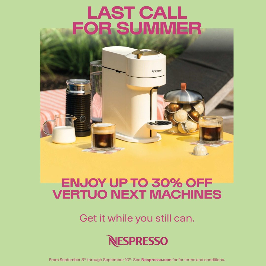 nespresso vertuo white coffee machine with two cups of coffee and milk