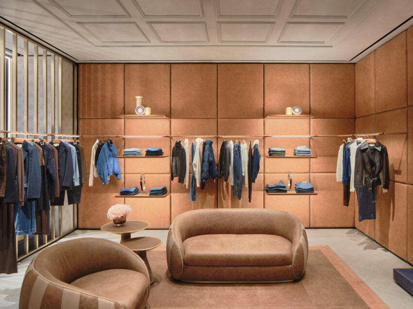 jacob cohen clothing hanging on racks and seating area