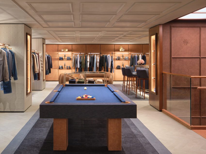 inside Jacob Cohen madison avenue store with pool table and clothing displayed