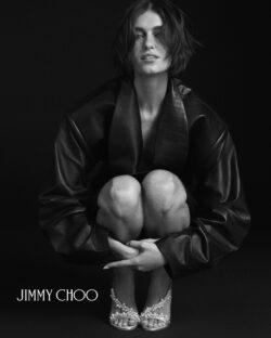 model sitting wearing leather jacket and Jimmy Choo pearl sandals